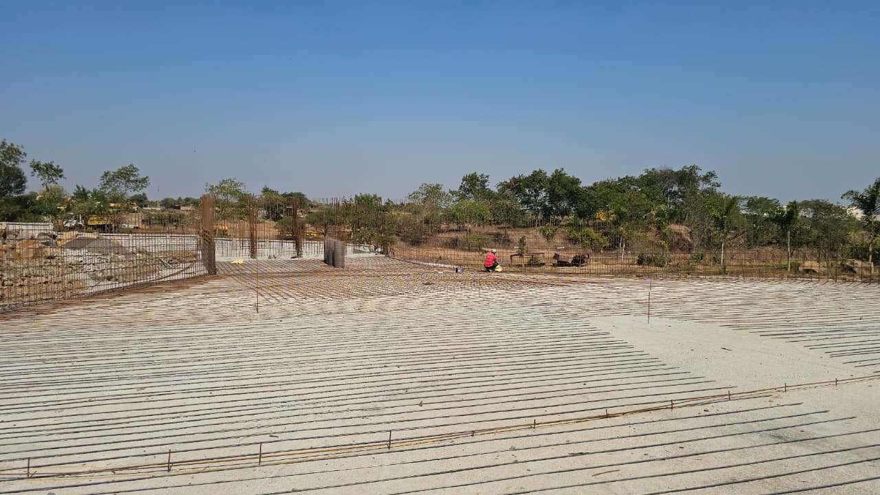 Reinforcement steel and starter columns across the pool footprint at the Aero City Water Park site, early structural stage